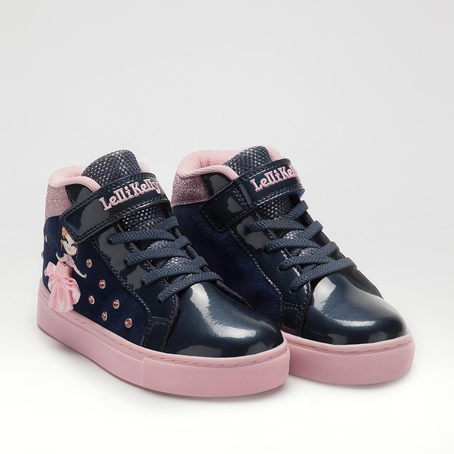 A pair of girls hi top trainers by Lelli Kelly, style Mille Stelle, in navy and pink suede with faux lace and velcro fastening. Angled view.