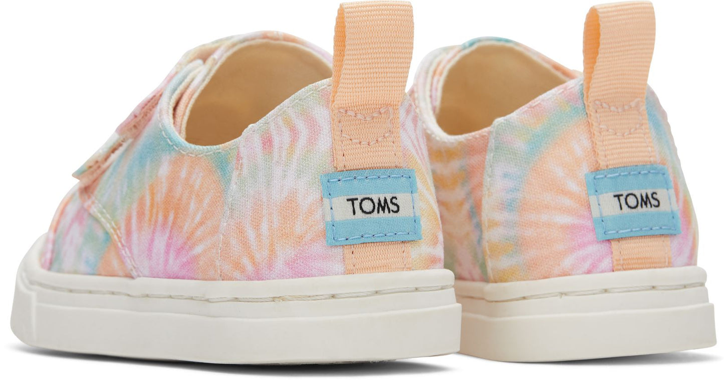 A girls canvas shoe by TOMS, style Cordones Cupsole, in Candy Pink Tie Dye with double velcro strap. Back view of a pair.