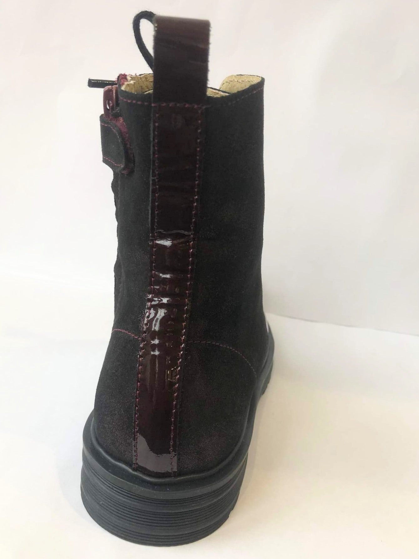 A girls boot by Petasil, style Clive 4, in burgundy patent/glitter leather with zip and lace fastening. Back view.