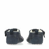 A pair of boys T-Bar shoes by Start-Rite, style Baby Jack, in navy leather with punch out detail and buckle fastening. View from back.