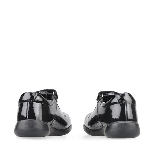 A pair of girls school shoes by Start Rite, style Star Jump, in black patent with velcro fastening. Back view.